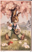 Joyeuses Pâques. Lapin jouant de la guitare adossé à un arbre en fleurs