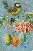 Joyeuses Pâques./ Mésange regardant à droite et trois oeufs suspendus à une branche de cerisier en fleur